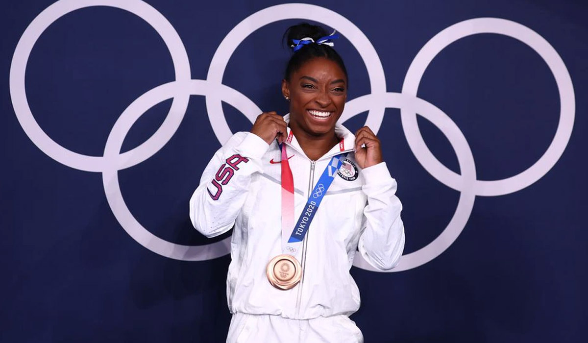 Many 'twisties' and turns, but Simone Biles exits Games a champion